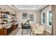 Comfortable office space filled with natural light and ample shelving for organization at 2963 Arranmore Dr, Ormond Beach, FL 32174