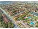 Aerial view of a townhouse community with a pool and clubhouse at 309 Verona Ave, Davenport, FL 33897