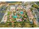 Aerial view of community pool area with many palm trees and seating at 309 Verona Ave, Davenport, FL 33897