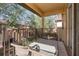 Relaxing balcony with patio furniture overlooking lush greenery at 309 Verona Ave, Davenport, FL 33897
