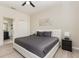 Comfortable bedroom with a ceiling fan, closet, and en-suite bathroom at 309 Verona Ave, Davenport, FL 33897