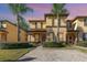 Charming townhome featuring a meticulously landscaped yard and a brick-paved walkway at 309 Verona Ave, Davenport, FL 33897