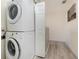 Convenient laundry room with a stacked washer and dryer at 309 Verona Ave, Davenport, FL 33897