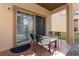Cozy covered patio with seating, perfect for outdoor relaxation at 309 Verona Ave, Davenport, FL 33897