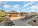 Relaxing poolside bar area with thatched roof and comfortable seating at 309 Verona Ave, Davenport, FL 33897