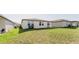 A house with a spacious backyard on a sunny day at 349 Guadlupe St, Haines City, FL 33844
