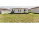 The backyard features a spacious lawn and rear house view at 349 Guadlupe St, Haines City, FL 33844