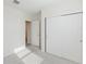 Clean, carpeted bedroom featuring closet and a doorway to another room at 349 Guadlupe St, Haines City, FL 33844