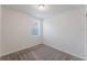 Clean, carpeted bedroom featuring a single window with mini blinds at 349 Guadlupe St, Haines City, FL 33844