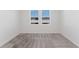 Cozy bedroom with carpet, two windows providing natural light, and neutral color palette at 349 Guadlupe St, Haines City, FL 33844
