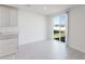 Bright dining area features sliding glass doors to the backyard, flooding the space with light at 349 Guadlupe St, Haines City, FL 33844