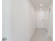 Bright hallway with hardwood floors leading to the front door at 349 Guadlupe St, Haines City, FL 33844