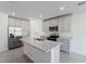 Modern kitchen with stainless steel appliances, a spacious island, and sleek countertops at 349 Guadlupe St, Haines City, FL 33844