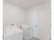 Bright laundry room equipped with modern washer and dryer at 349 Guadlupe St, Haines City, FL 33844
