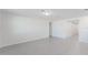 Spacious living room features tile floors and neutral paint, with easy access to other rooms at 349 Guadlupe St, Haines City, FL 33844