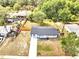 An aerial view of a quaint home featuring a fenced backyard and a neatly paved driveway at 358 Prevo Dr, Apopka, FL 32712