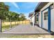 View of a large new wooden deck with railings overlooking the backyard and wooden fence at 358 Prevo Dr, Apopka, FL 32712