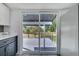 View of the deck from the kitchen through a sliding glass door at 358 Prevo Dr, Apopka, FL 32712