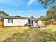Expansive backyard with a wooden deck and well-maintained lawn at 358 Prevo Dr, Apopka, FL 32712