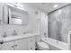 Bright bathroom features white cabinets, modern fixtures, a shower-tub combo, and gray floors at 358 Prevo Dr, Apopka, FL 32712