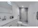Modern bathroom with stylish tiled shower, updated vanity, and new lighting fixtures at 358 Prevo Dr, Apopka, FL 32712