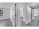 Bedroom with a light gray wood floor and barn door at 358 Prevo Dr, Apopka, FL 32712