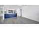 Bright kitchen with new gray flooring, vaulted ceilings and eat-in counter at 358 Prevo Dr, Apopka, FL 32712