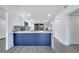 Open kitchen with island featuring white countertops and blue cabinets, and stainless steel appliances at 358 Prevo Dr, Apopka, FL 32712