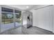 Stainless steel refrigerator next to a sliding glass door leading to the deck at 358 Prevo Dr, Apopka, FL 32712