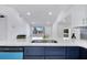 New kitchen features sleek stainless steel sink, white quartz countertops and modern lighting at 358 Prevo Dr, Apopka, FL 32712