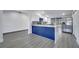 Spacious kitchen with center island, stainless steel refrigerator and sliding glass door at 358 Prevo Dr, Apopka, FL 32712