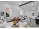 Bright living room features a vaulted ceiling, gray wood flooring, and modern furnishings at 358 Prevo Dr, Apopka, FL 32712