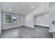 Bright living room featuring an open floor plan and wood-look floors at 358 Prevo Dr, Apopka, FL 32712