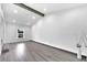 Light-filled living room with gray wood floors, recessed lighting, and a high ceiling at 358 Prevo Dr, Apopka, FL 32712