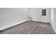 Living room with gray wood flooring, white walls, and white trim at 358 Prevo Dr, Apopka, FL 32712