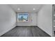Bright and spacious living room with new gray flooring, baseboards, fresh paint and front window at 358 Prevo Dr, Apopka, FL 32712