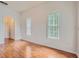 Bedroom with hardwood floors and sunlit windows, creating a cozy retreat at 3621 Conroy Rd # 738, Orlando, FL 32839