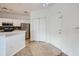 Neutral entryway featuring tiled flooring, coat closet, and white front door at 3621 Conroy Rd # 738, Orlando, FL 32839