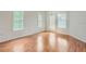 Spacious living room with ample windows, creating a bright and airy atmosphere with the warmth of hardwood floors at 3621 Conroy Rd # 738, Orlando, FL 32839