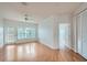 Spacious living room with hardwood floors, bright natural light, and a ceiling fan at 3621 Conroy Rd # 738, Orlando, FL 32839