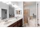 Bright bathroom with double vanity, soaking tub, and separate glass shower at 401 Harbor Winds Ct, Winter Springs, FL 32708