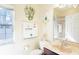 Bathroom with light yellow walls, vanity and marble sink top at 401 Harbor Winds Ct, Winter Springs, FL 32708