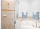 Bathroom featuring a jacuzzi tub with tile surround and glass shower at 401 Harbor Winds Ct, Winter Springs, FL 32708