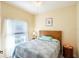 Cozy bedroom with a wood bed frame and natural light at 401 Harbor Winds Ct, Winter Springs, FL 32708