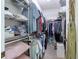 Walk-in closet with metal shelves and clothing racks at 401 Harbor Winds Ct, Winter Springs, FL 32708