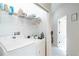 Laundry room with washer, dryer, and overhead shelving at 401 Harbor Winds Ct, Winter Springs, FL 32708