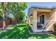 Inviting covered patio with outdoor seating and lush landscaping perfect for relaxing and entertaining at 401 Harbor Winds Ct, Winter Springs, FL 32708