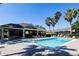 Community pool with lounge seating and covered pavilion at 401 Harbor Winds Ct, Winter Springs, FL 32708
