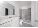 A bathroom featuring a stand-up shower, vanity, and neutral color scheme at 4224 Pebbles Throw Dr, Kissimmee, FL 34746