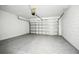 An open garage showcases epoxy floors and an insulated garage door at 4224 Pebbles Throw Dr, Kissimmee, FL 34746